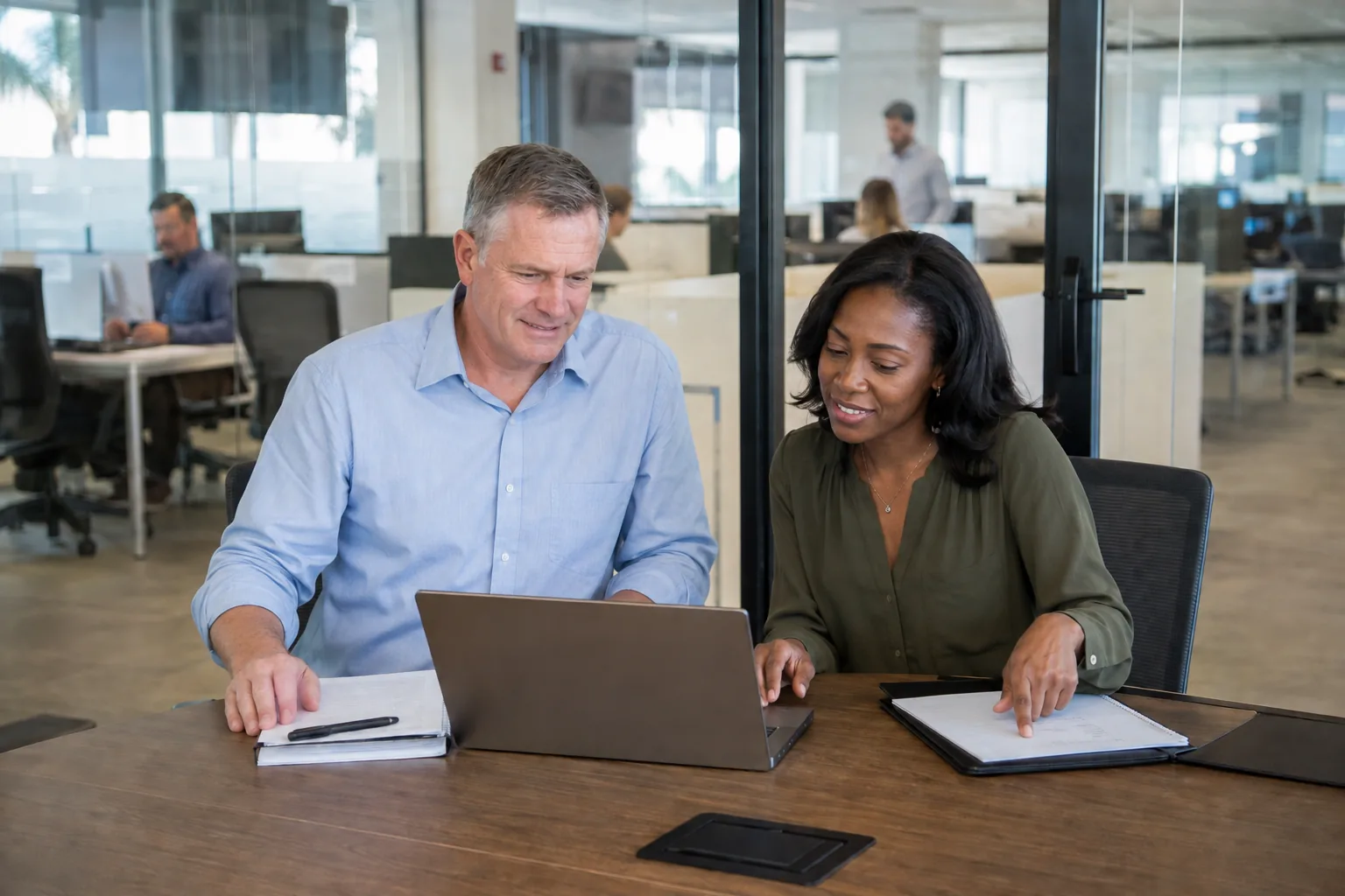 The same business leaders review their priorities with relaxed expressions.